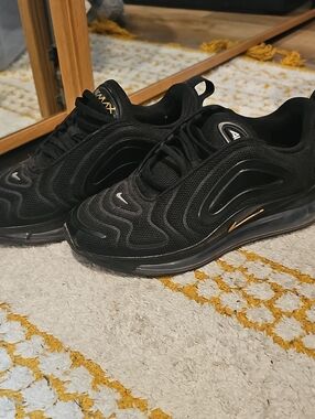 Nike Women’s Black Sneakers with Gold Accents